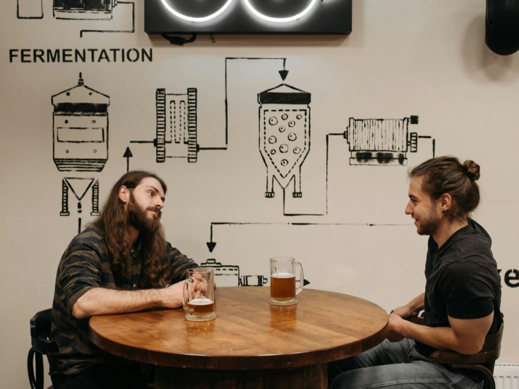 guys having beer in a brewery