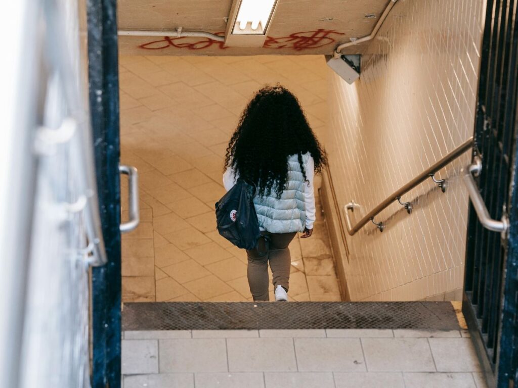 woman walking in a subway station