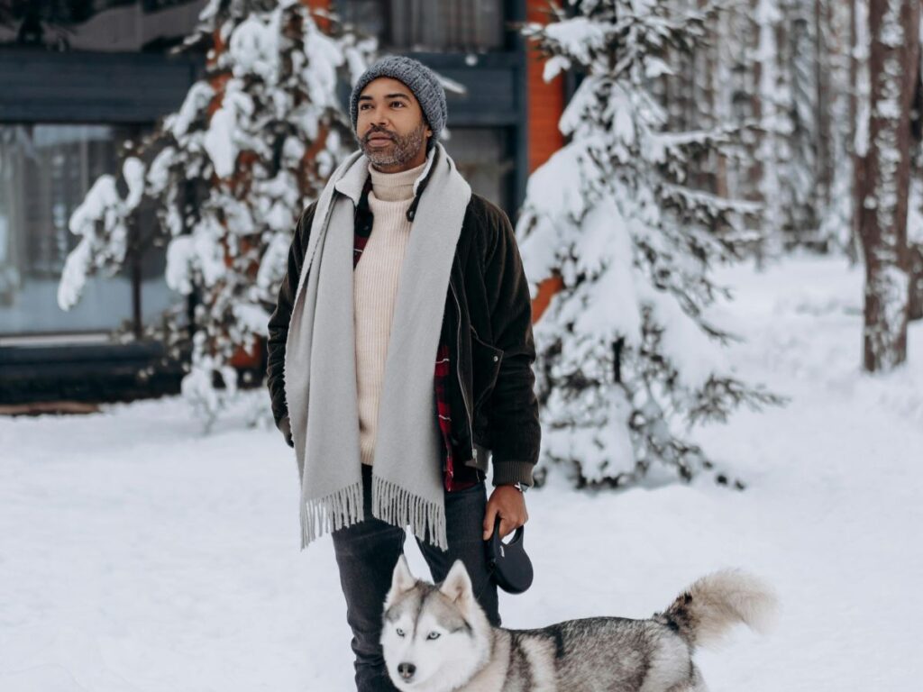 man standing with his dog