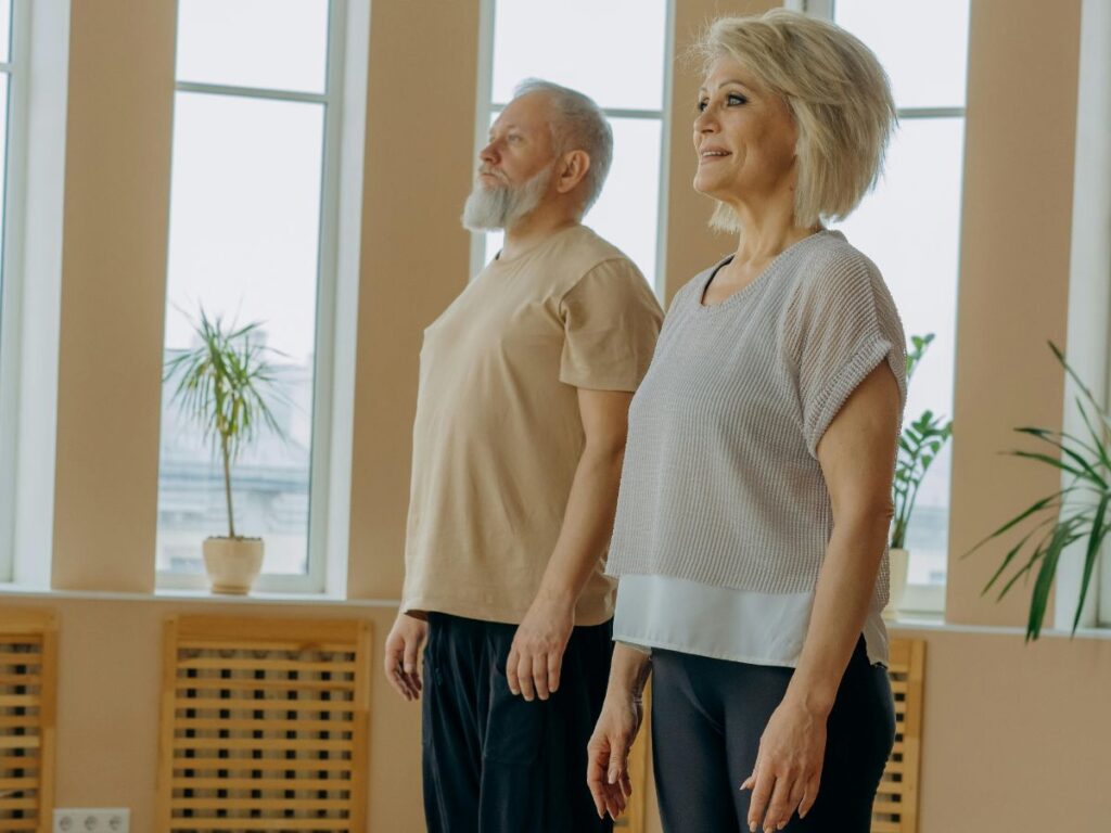 senior citizens doing yoga