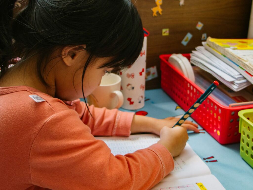 child studying in daycare