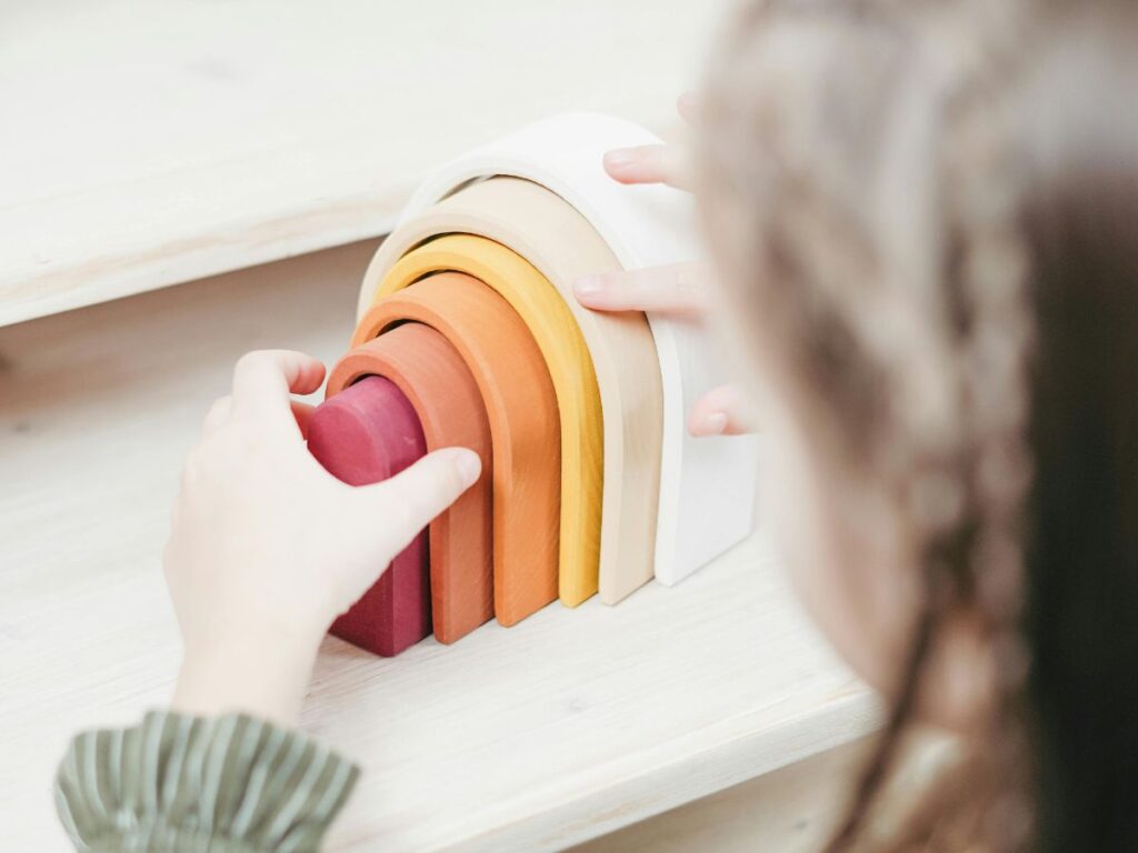 kid playing with toys