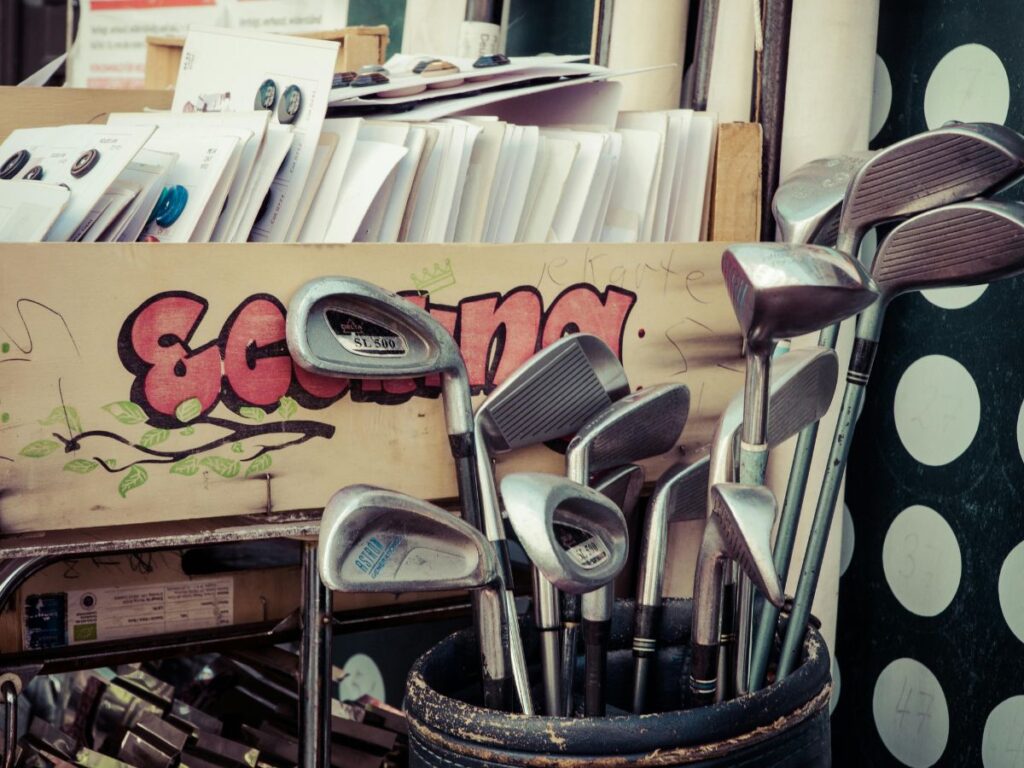 golf sticks in a flea market