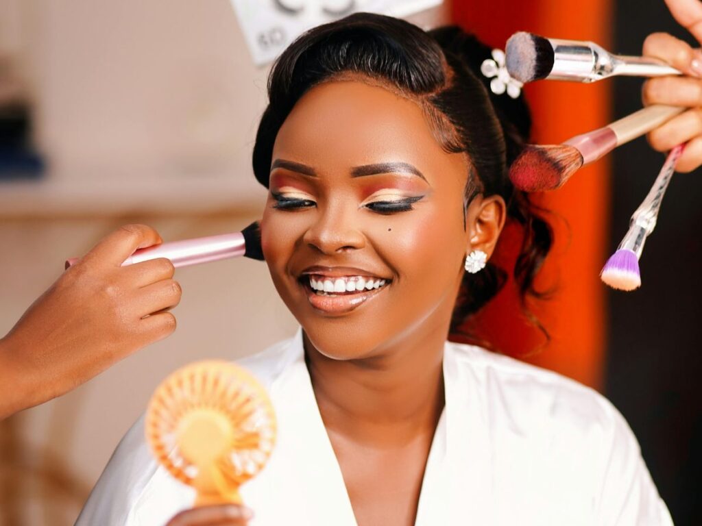 woman getting her makeup and hair done