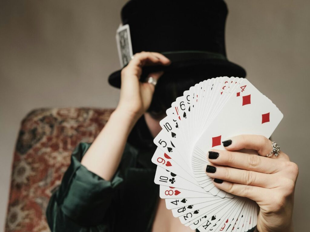 magician holding cards