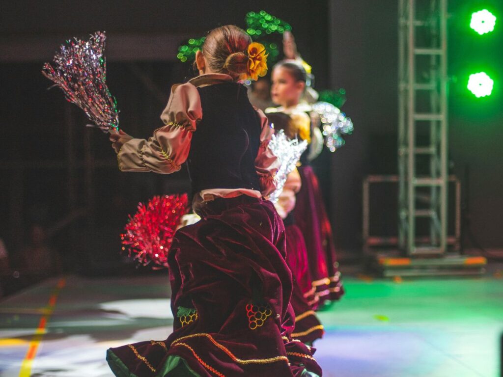 girls performing on stage in theatre