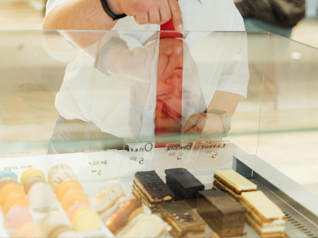 man buying bakery items