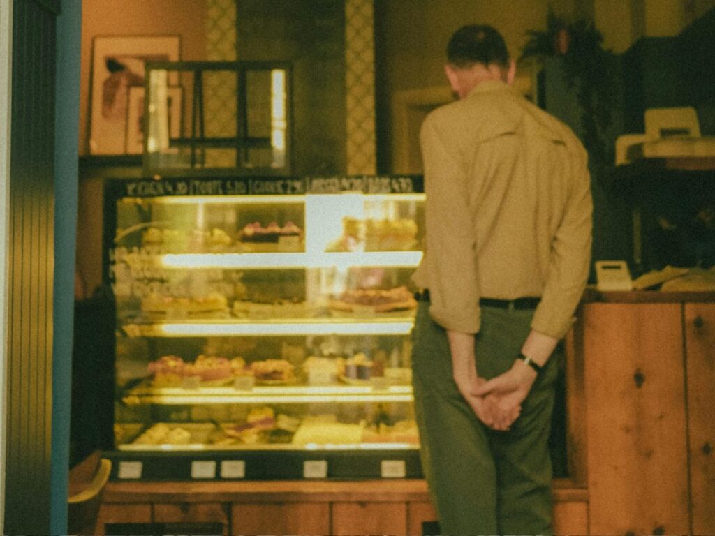 man buying bakery items