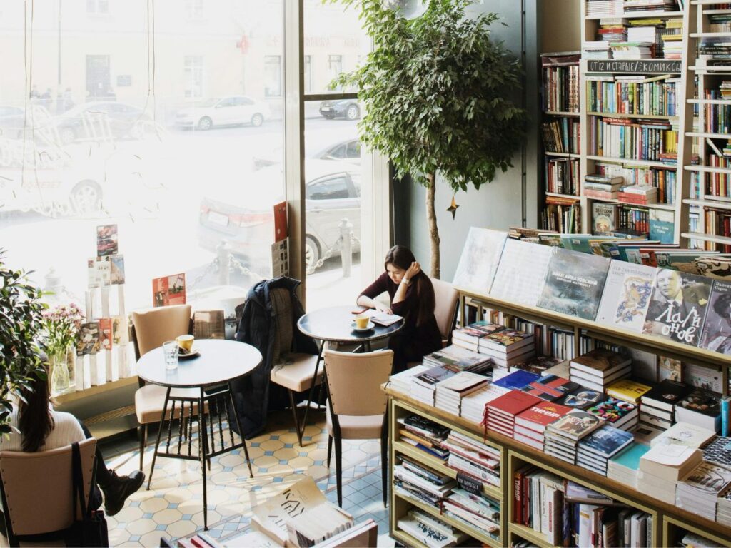 woman reading book in a bookstore