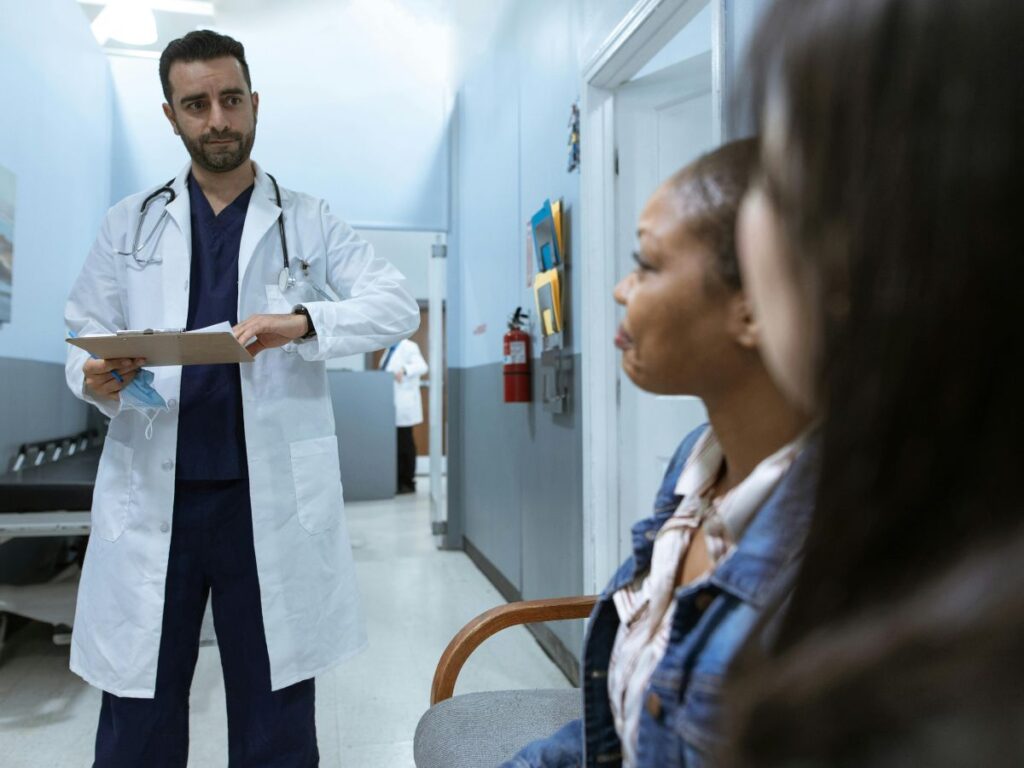 doctor talking to attendants