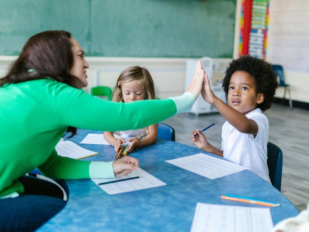 teacher with students in a classroom