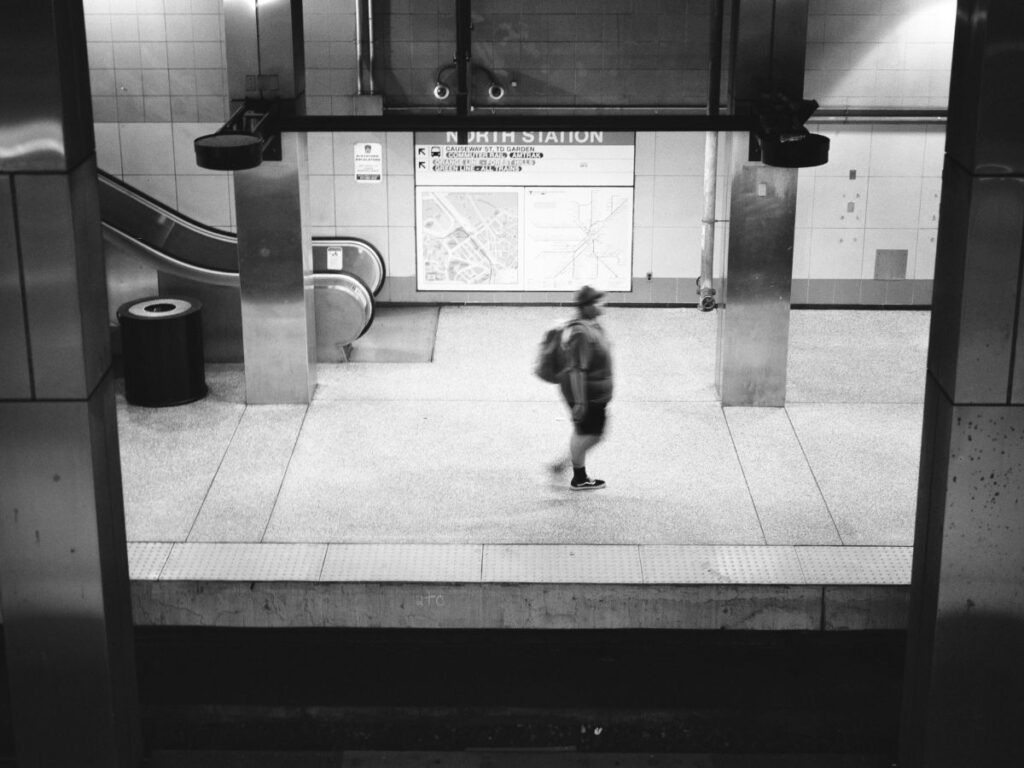 man waiting in a transit station