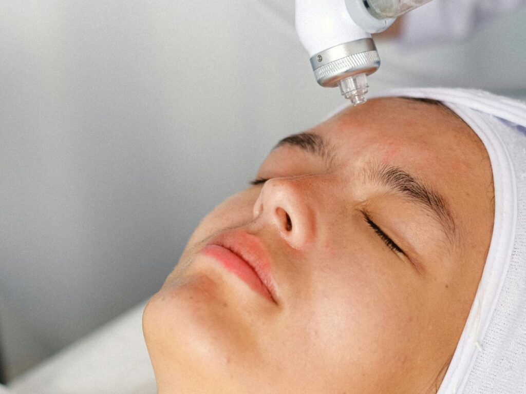 woman getting face treatment