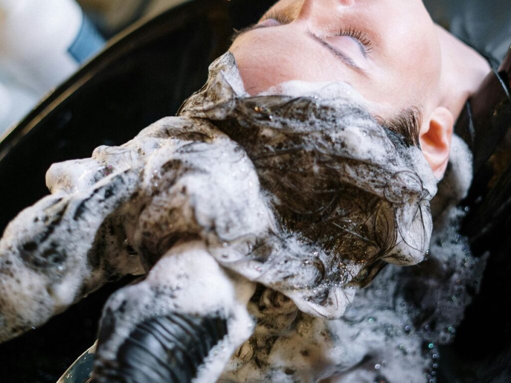 girl getting a hairwash