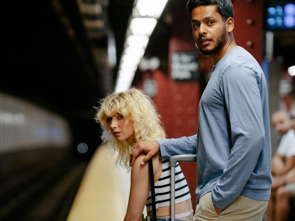 people waiting for train in subway station