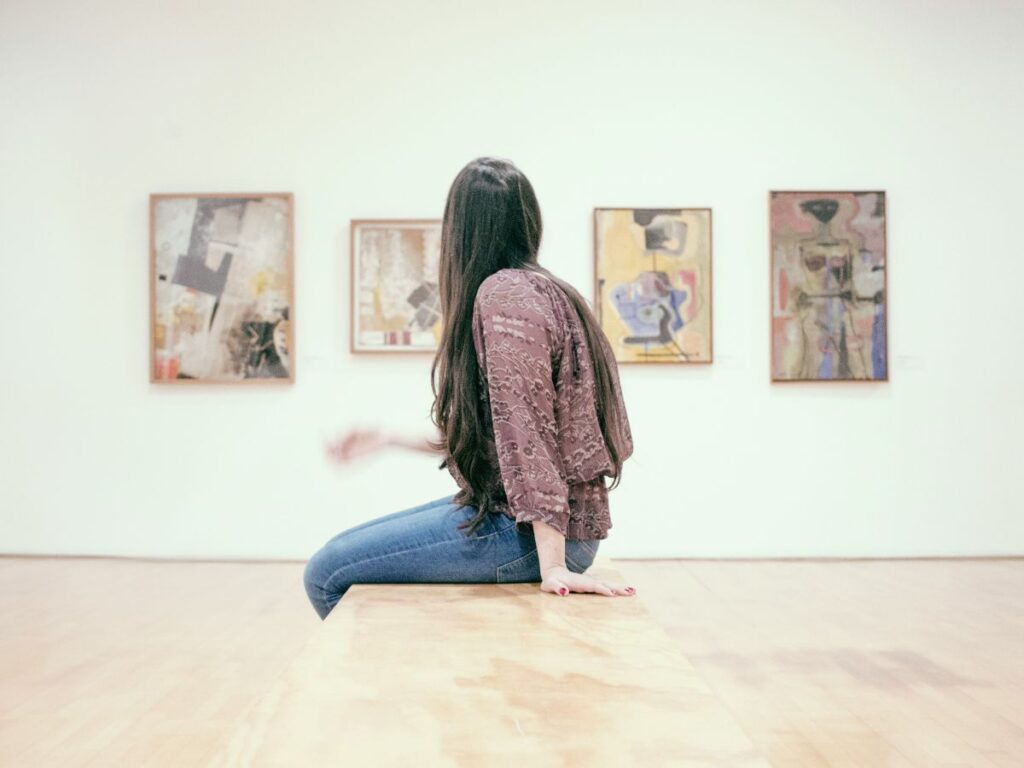 woman sitting in an art gallery