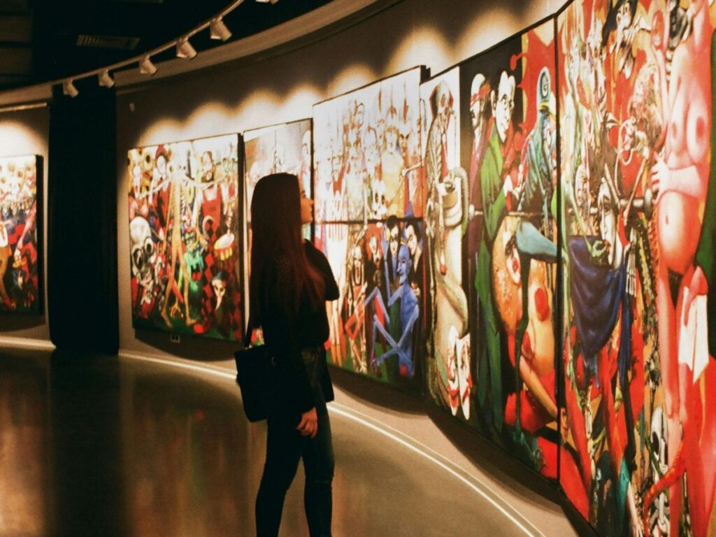 woman looking at art in a gallery