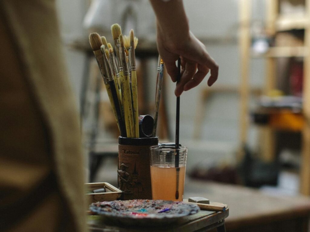 artist cleaning his brush