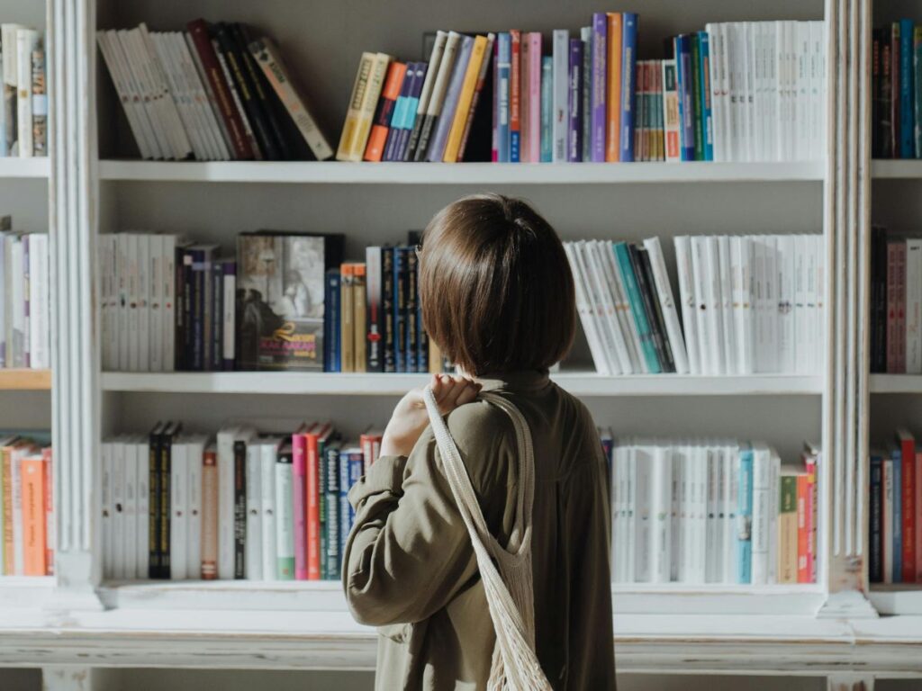 woman looking at books in a bookstore