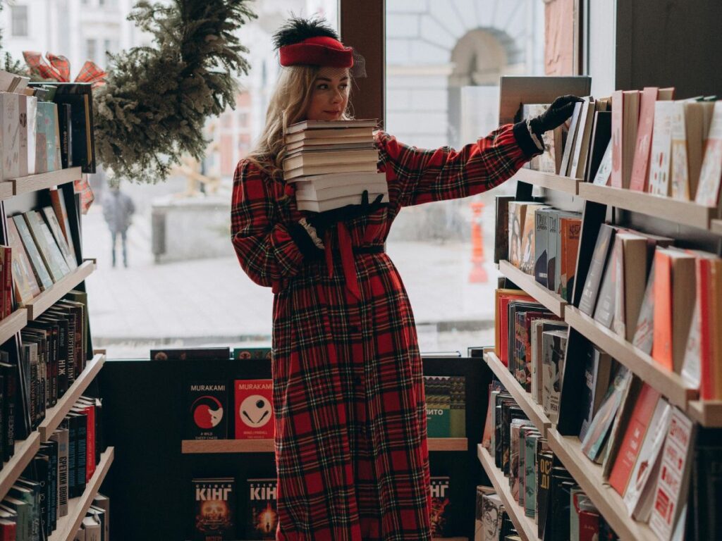 woman collecting books to buy