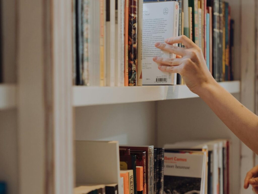 taking book out of a shelf