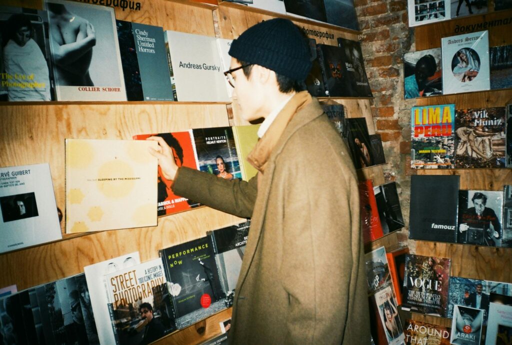 man choosing books in a bookstore