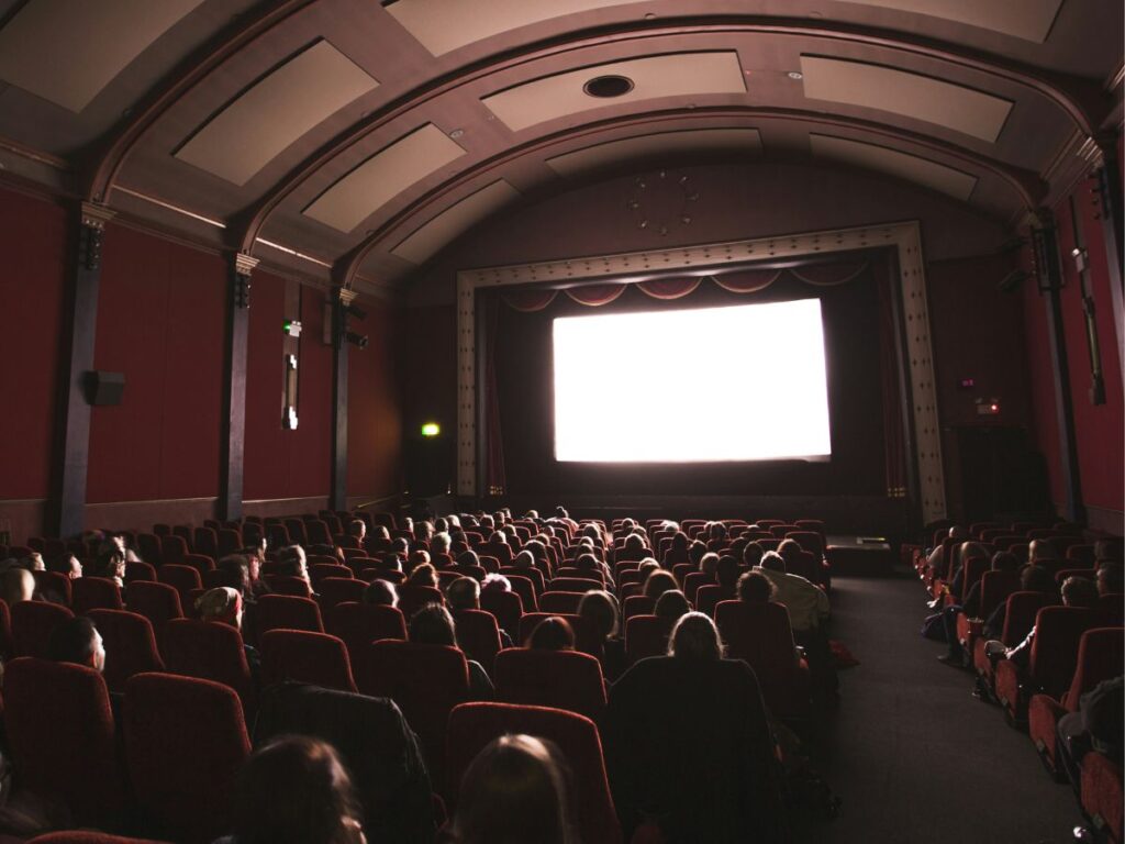 people watching movie in a cinema