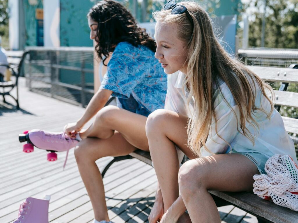 girls wearing skating shoes in a park