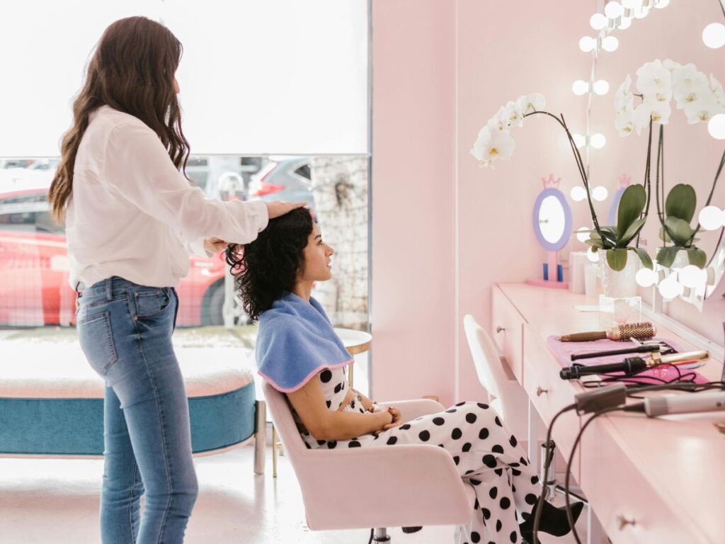 woman getting hair styled