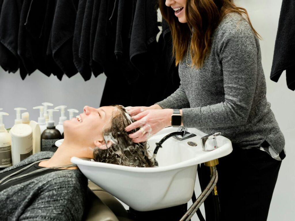 woman getting her hair washed