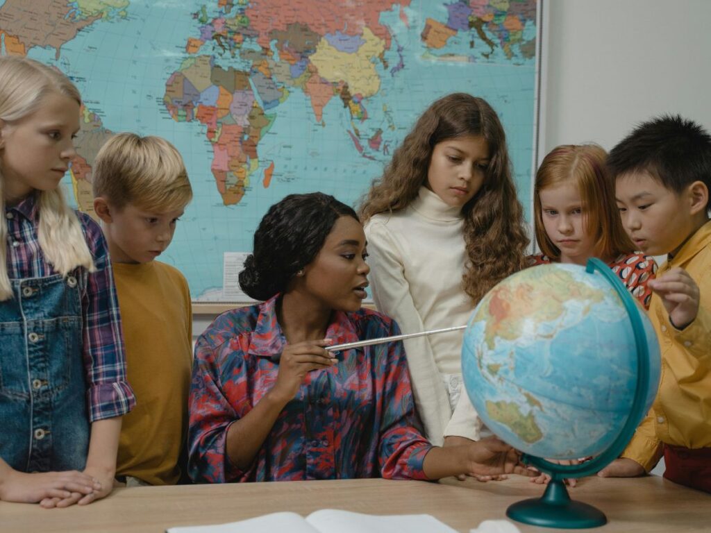 students with teacher in classroom