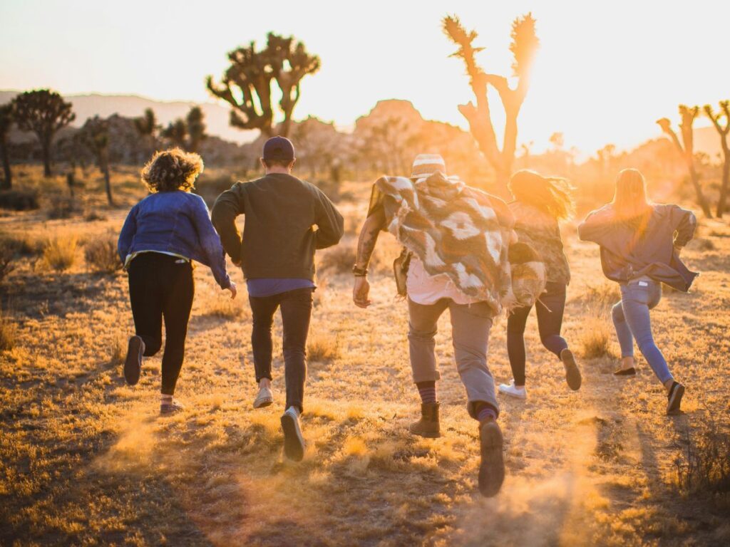 people running on a beach