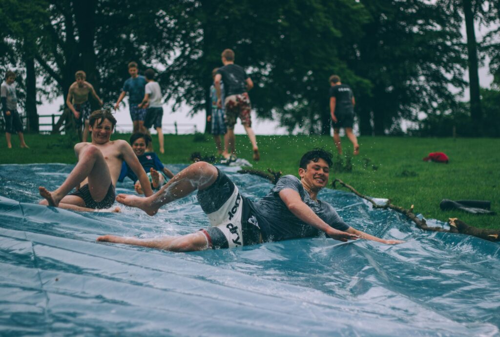 people swimming in a community centre