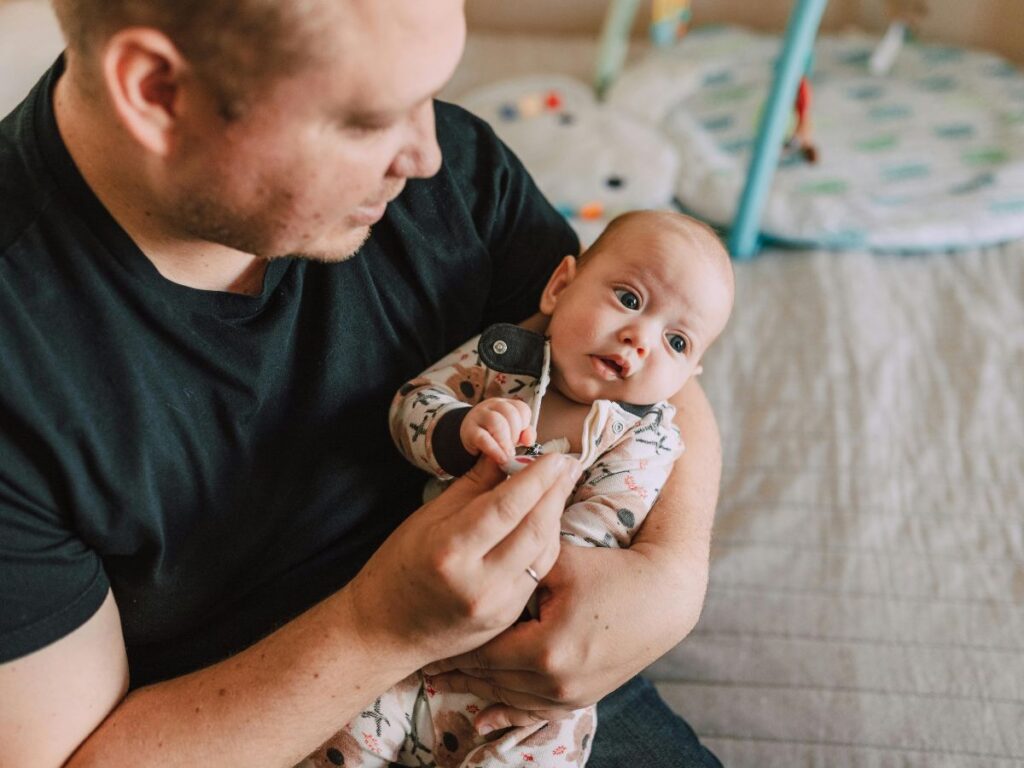 man holding a baby