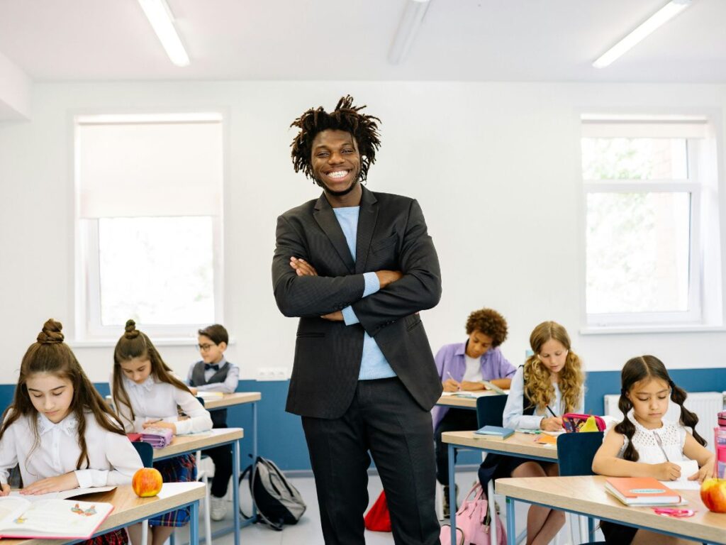 teacher teaching students in a classroom