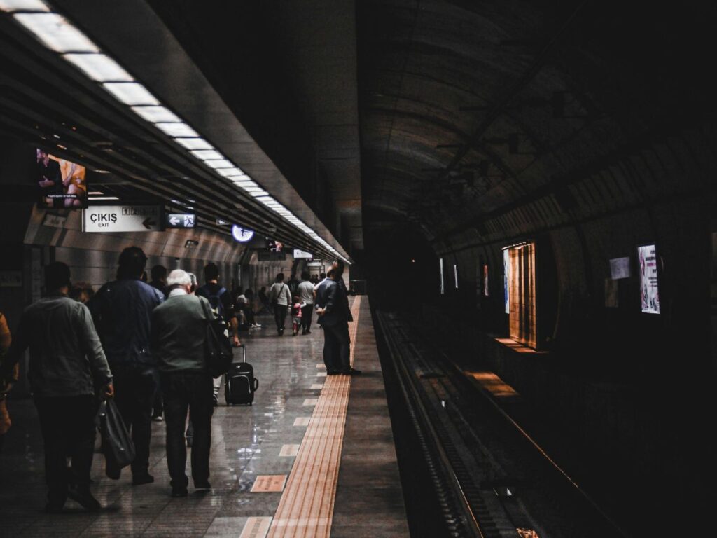 people waiting in a transit station