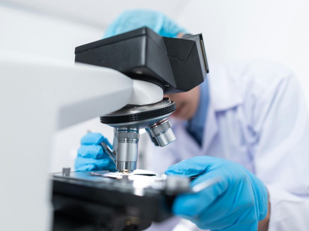 doctor using microscope in a hospital