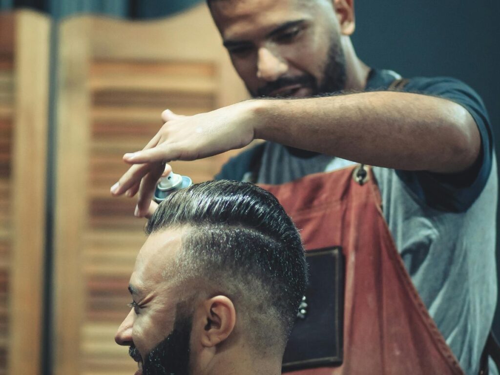 barber setting a customer's hair