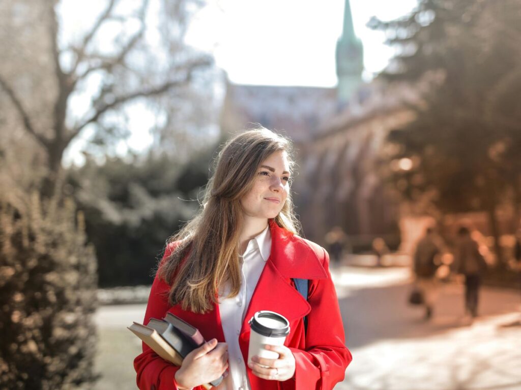university student holding coffee