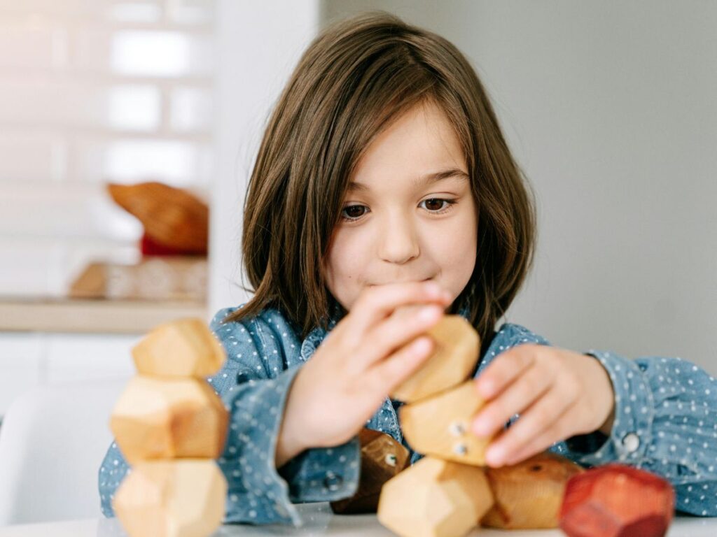girl playing with toys