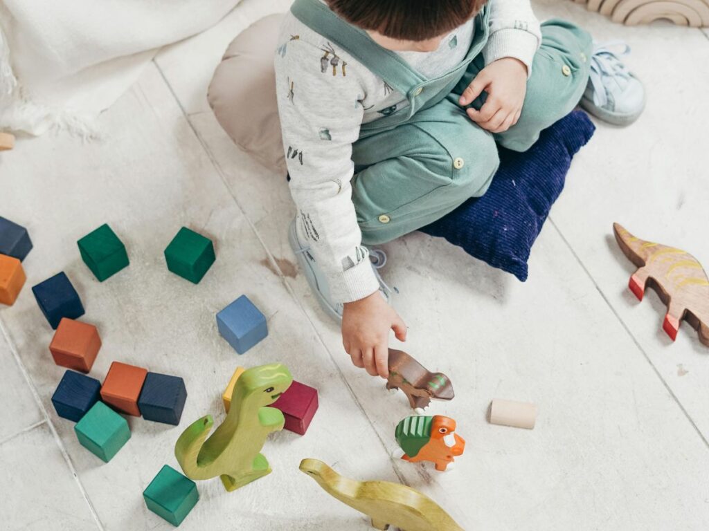 kid playing with toys