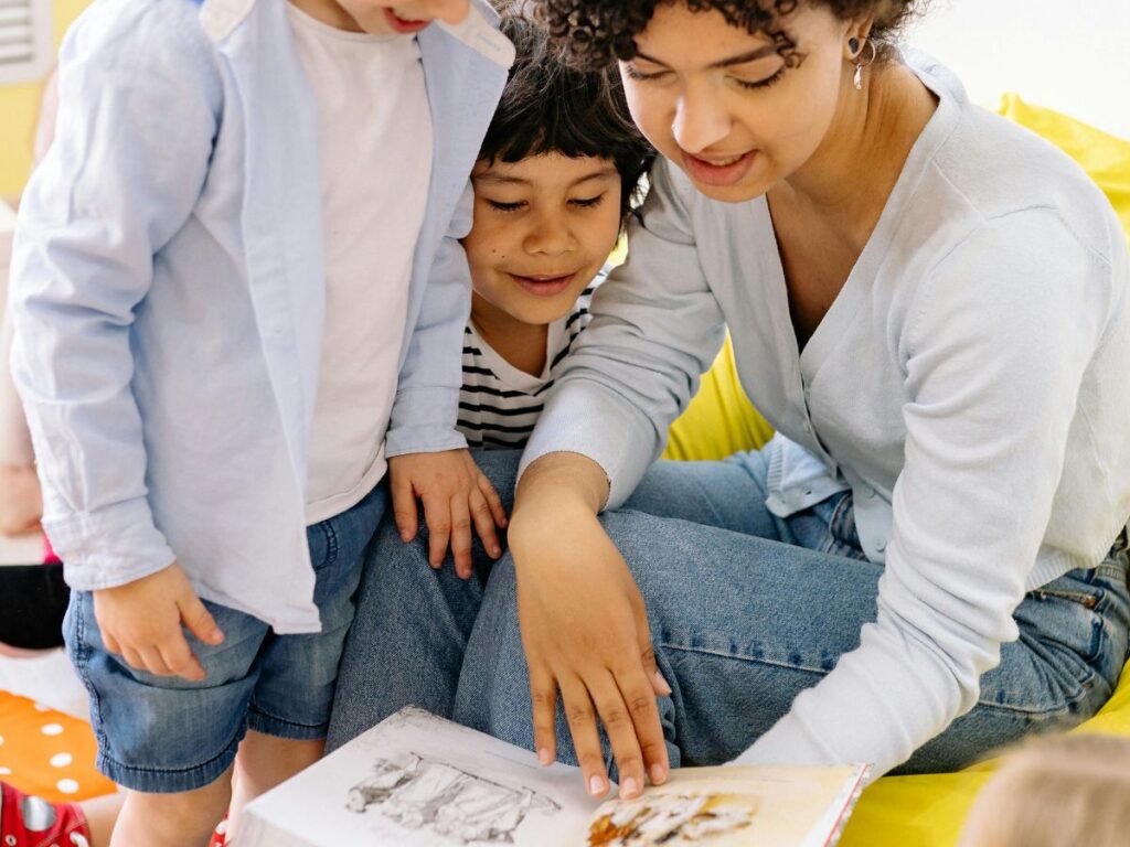 teacher reading kids a book